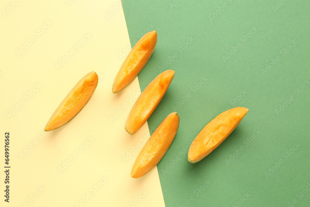 Pieces of sweet melon on colorful background