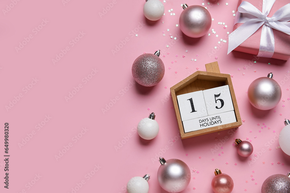 Composition with countdown calendar, Christmas balls and gift box on pink background