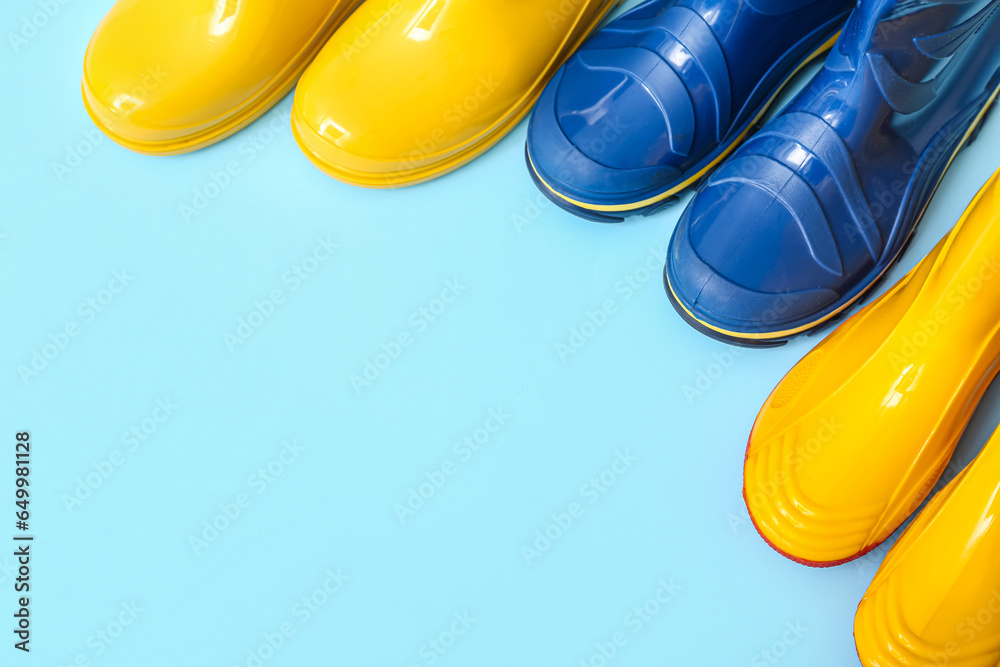 Different gumboots on blue background