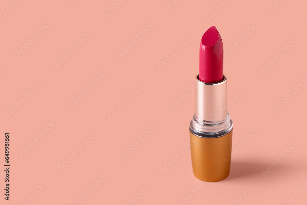 Stylish new lipstick on pink background