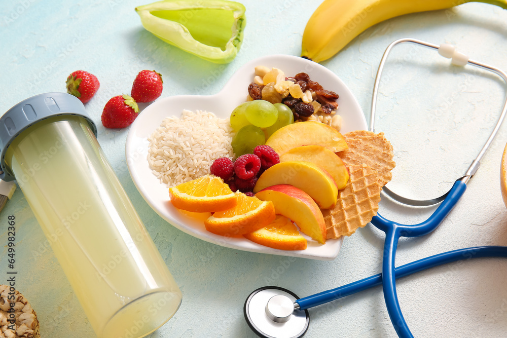 Plate with fresh healthy products and bottle of beverage on light background, closeup. Diet concept