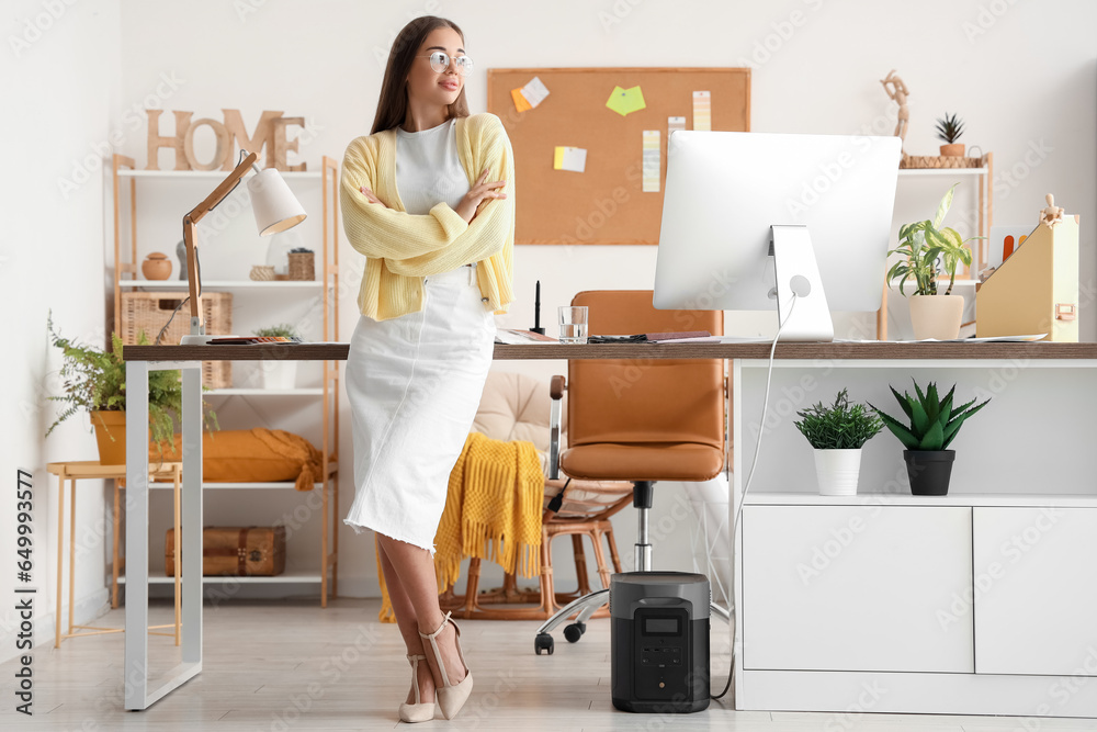 Female interior designer working in office