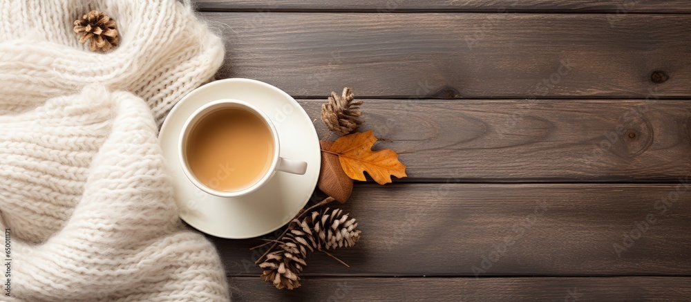 Autumn vibes with coffee sketchbook sweater and cozy lights from a top view