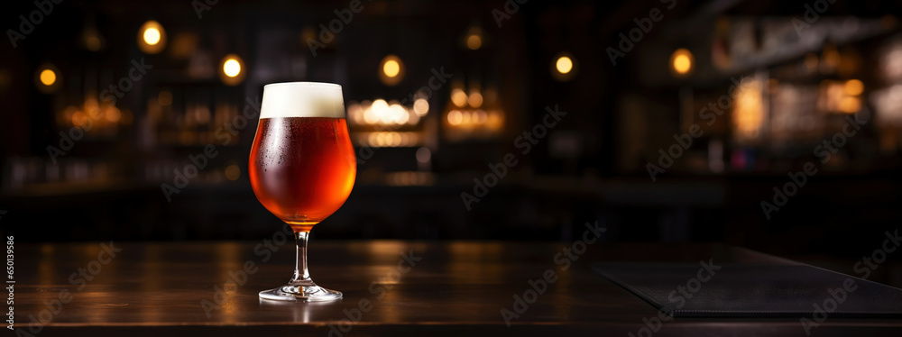 Snifter glass of light beer on bar table in a dark pub with copy space. Generative AI