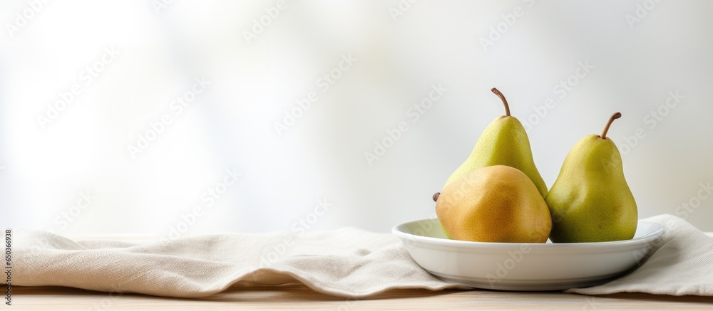 Minimalistic indoor scene with three pears on a ceramic plate white table and net curtain Light wall with copy space in the backdrop