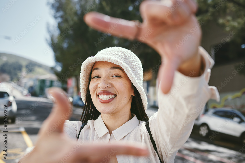 Happy woman, portrait and frame in city for photography, fashion or outdoor memory in selfie. Female person smile with hands framing face for photograph, picture or social media tour in urban town