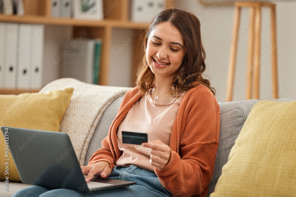 Laptop, credit card and ecommerce with a woman in her home for bank payment or accounting. Computer, finance or budget with a happy young customer in the living room for online shopping or retail