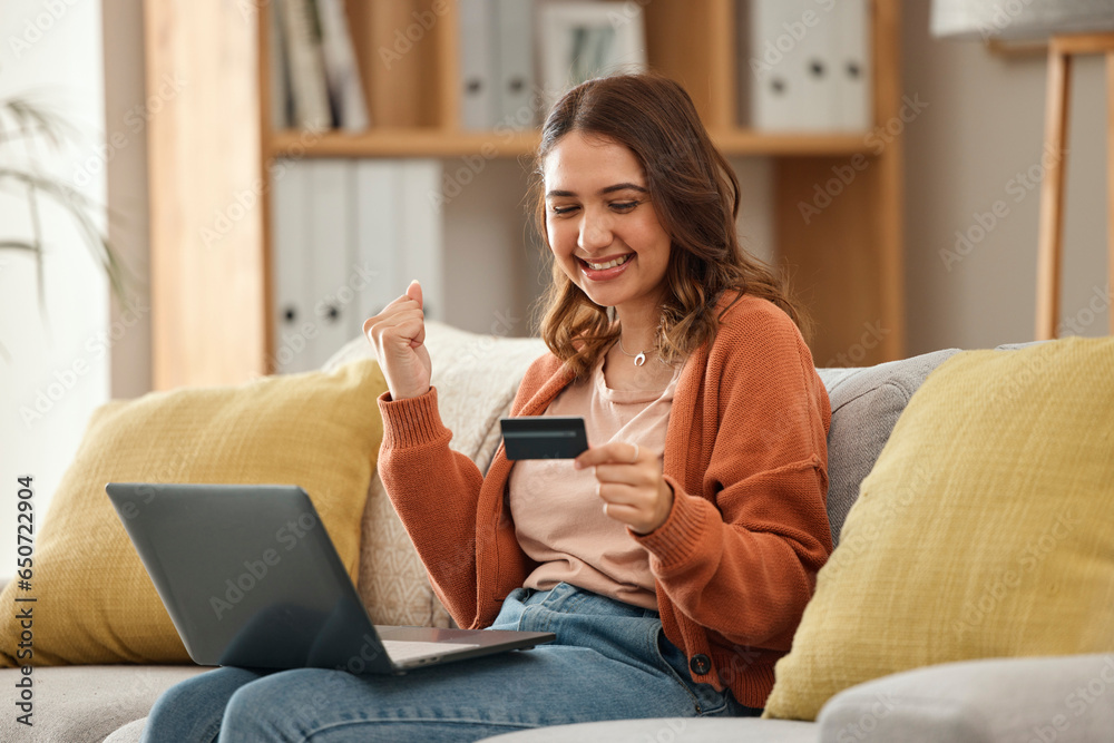 Excited, woman and laptop with credit card, banking and online shopping with fintech, transaction and happiness in a lounge. Person, home and girl on a couch, pc and celebration with payment or bonus