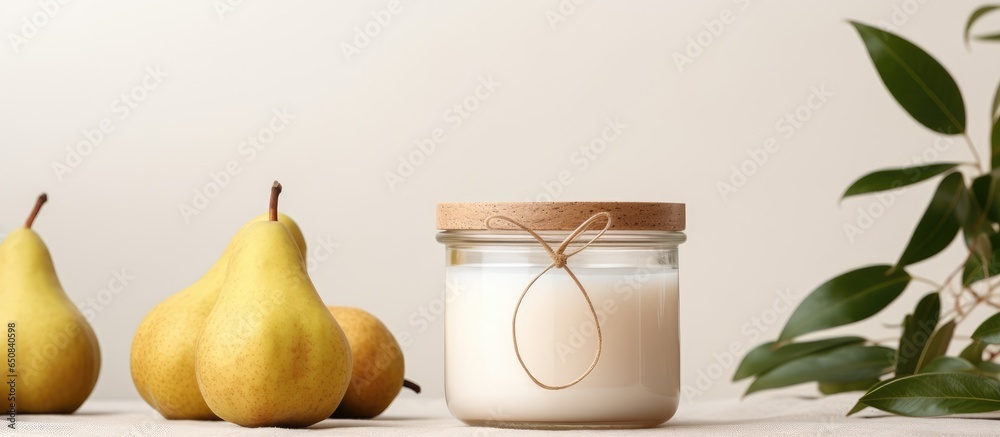 Eco friendly mockup of a branded candle with natural pear decoration in a glass jar