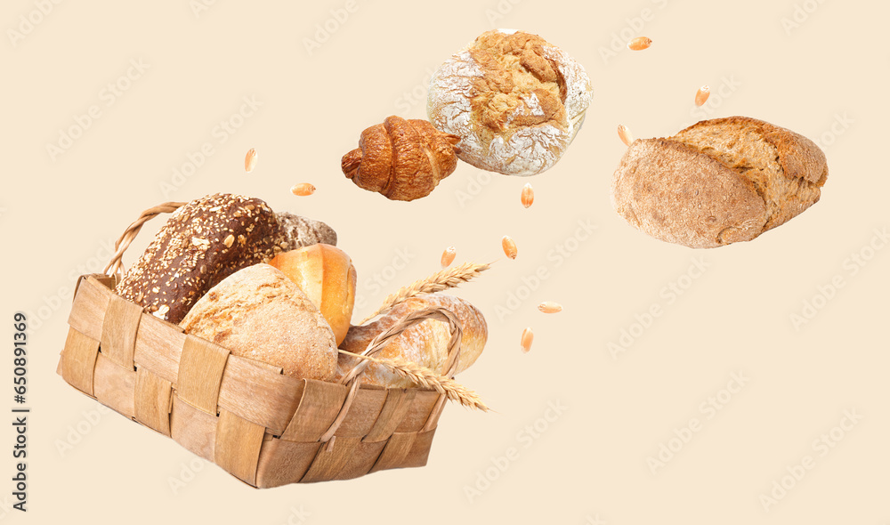 Basket with loaves of different bread isolated on white background