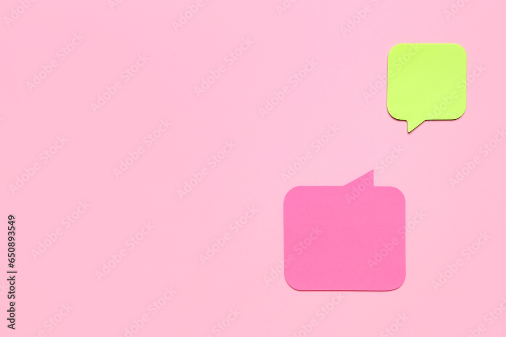 Blank speech bubbles on pink background