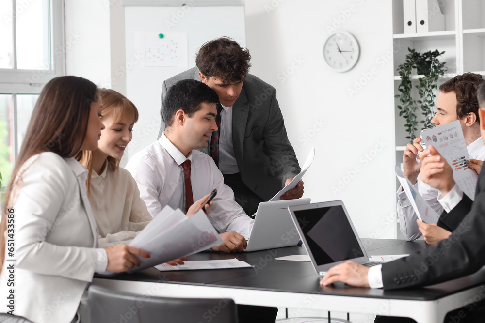 Group of business consultants working in office