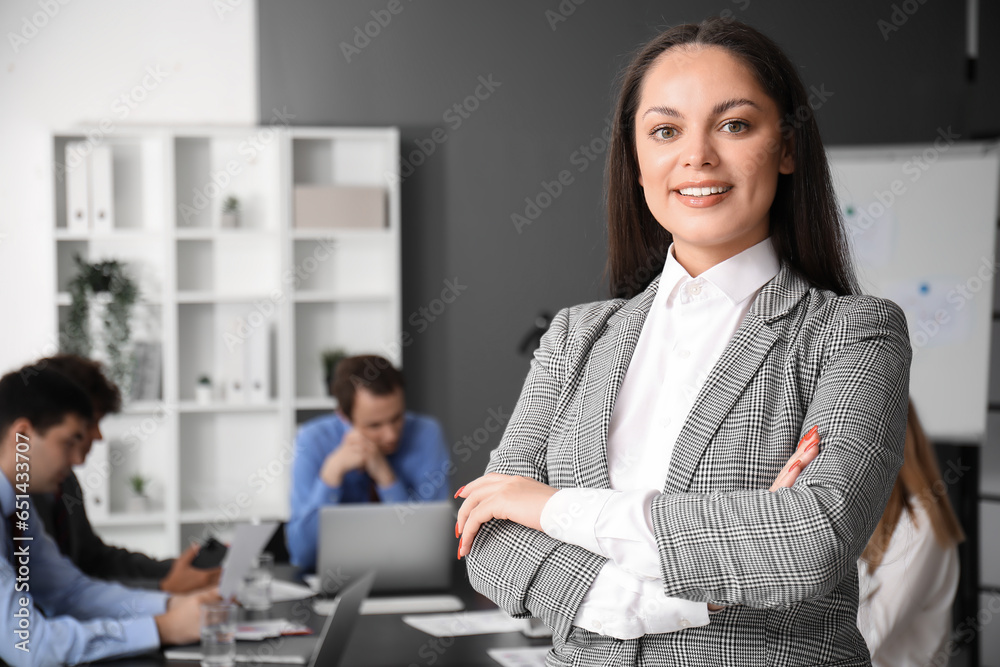 Female business consultant working in office