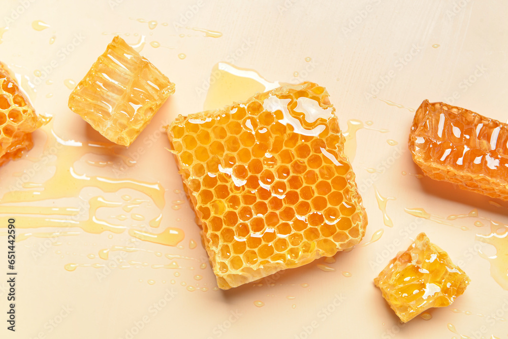 Sweet honeycombs on yellow background