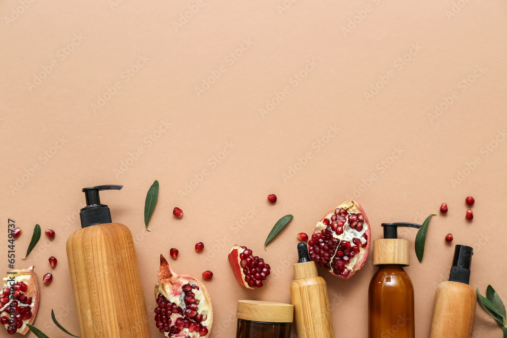 Composition with different cosmetic products and pomegranate on color background