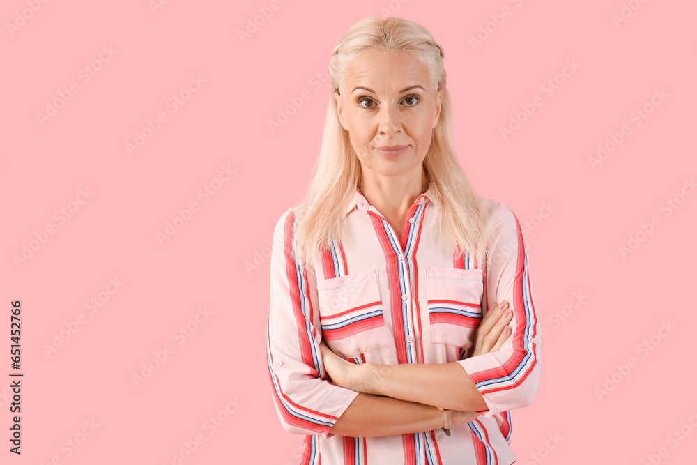 Mature woman on pink background