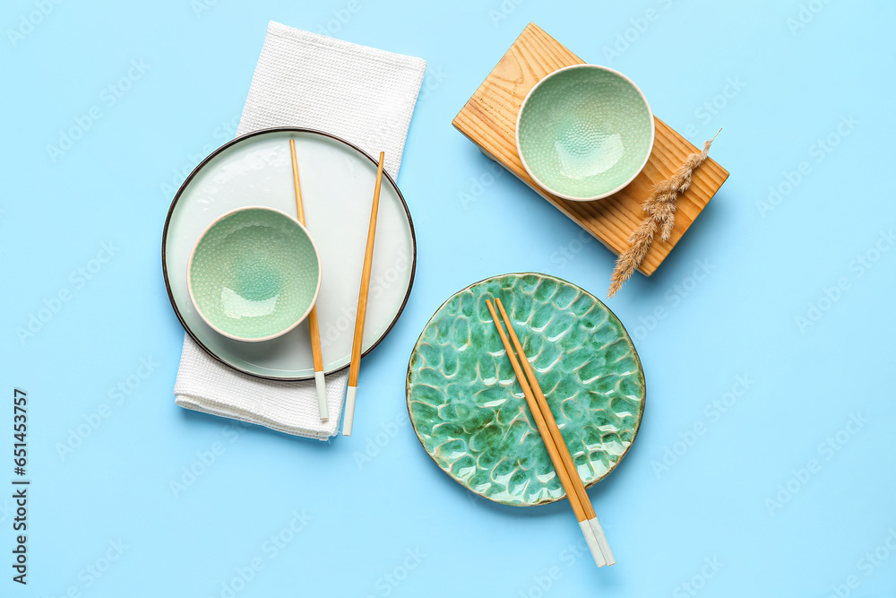 Chinese table setting on light blue background