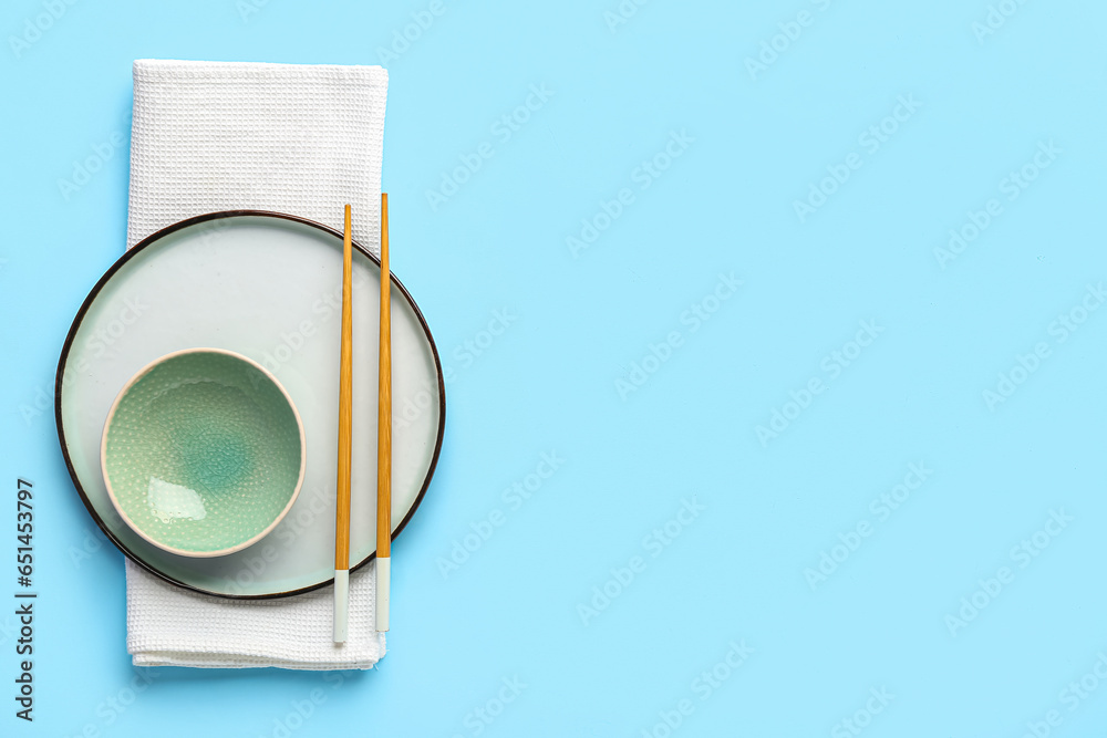 Chinese table setting on light blue background