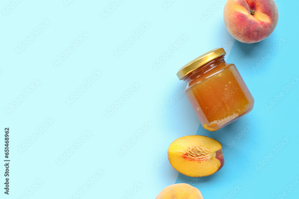 Composition with glass jar of tasty peach jam and fresh fruits on color background