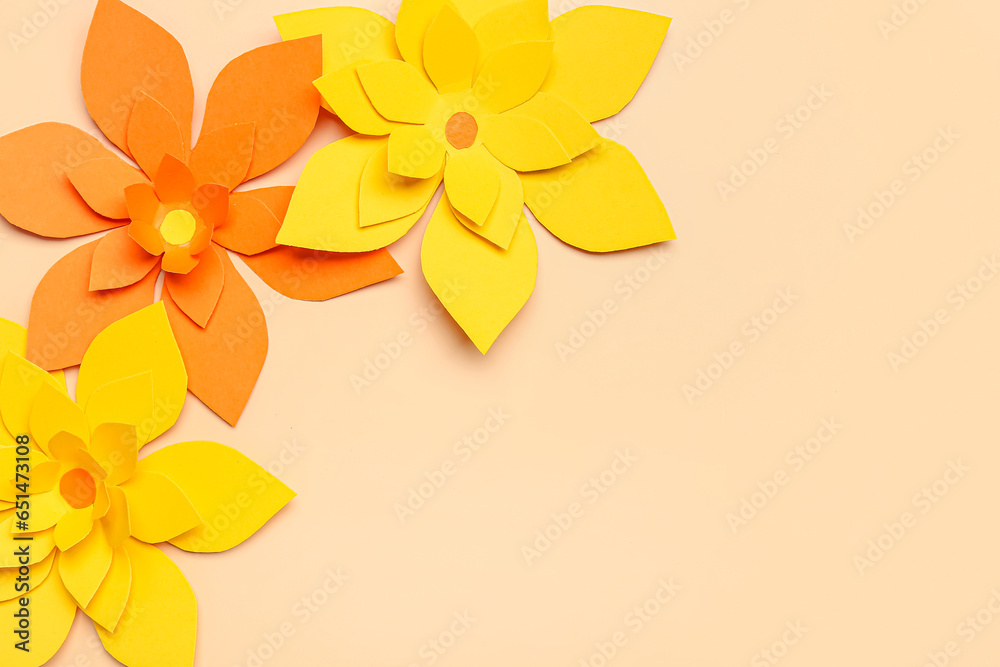 Colorful origami flowers on beige background