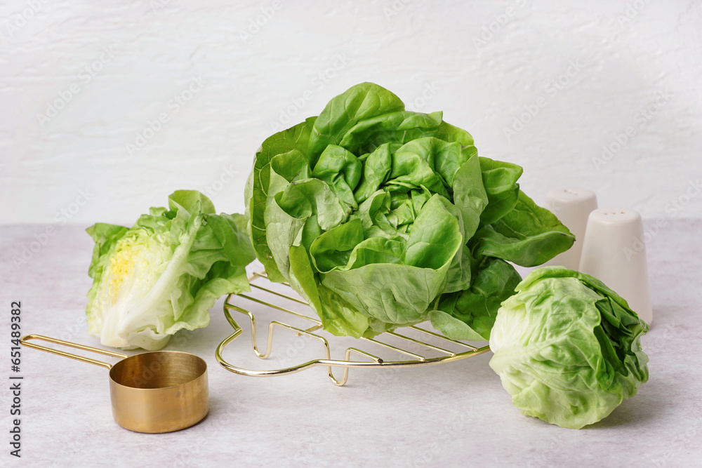 Grid with fresh Boston lettuce on white background