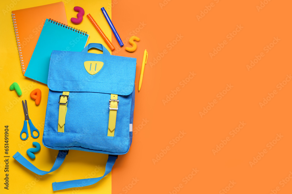 Stylish school backpack with different stationery on color background