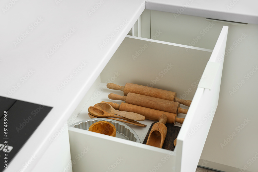 Set of utensils for bakery in drawer at kitchen