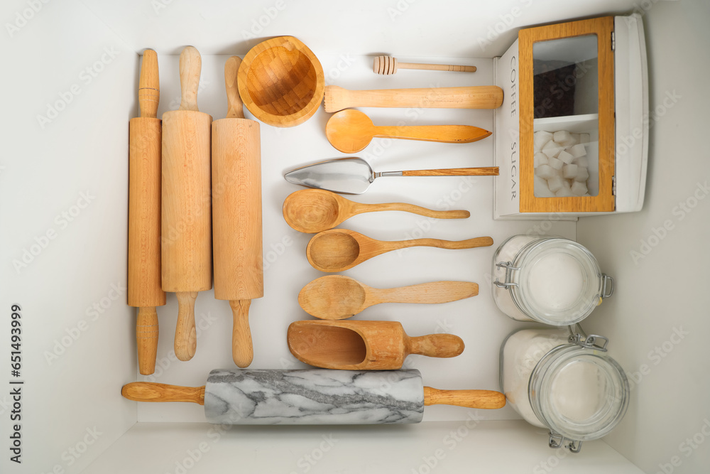 Set of utensils for bakery in drawer at kitchen