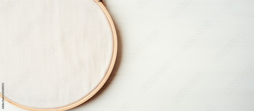 Empty space for hobby design with wooden embroidery hoop and white fabric template