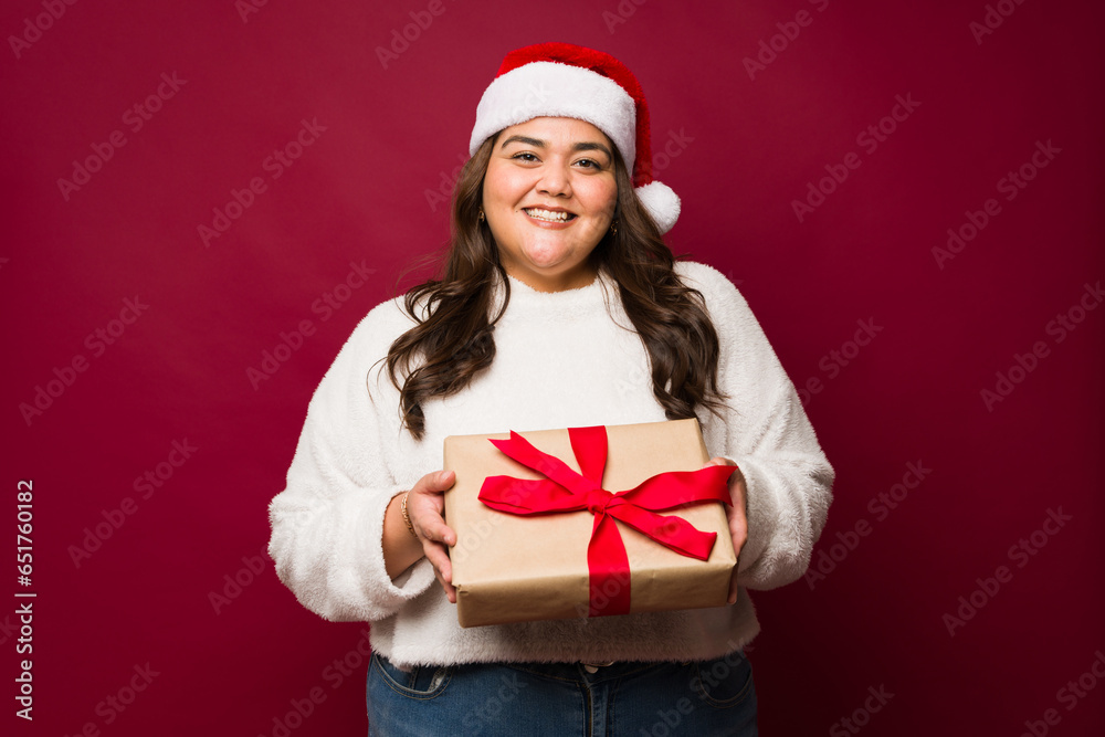 Attractive woman happy with her christmas gift