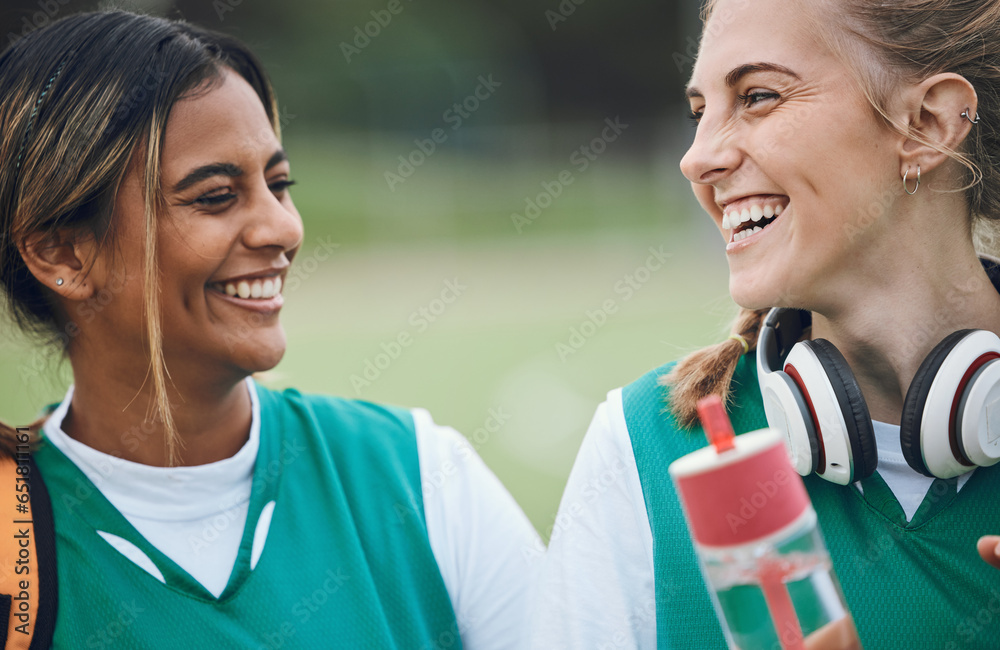 Laughing, team sports or women in conversation on turf or court for break after fitness training or exercise. Smile, happy friends or funny female hockey players speaking or talking to relax together