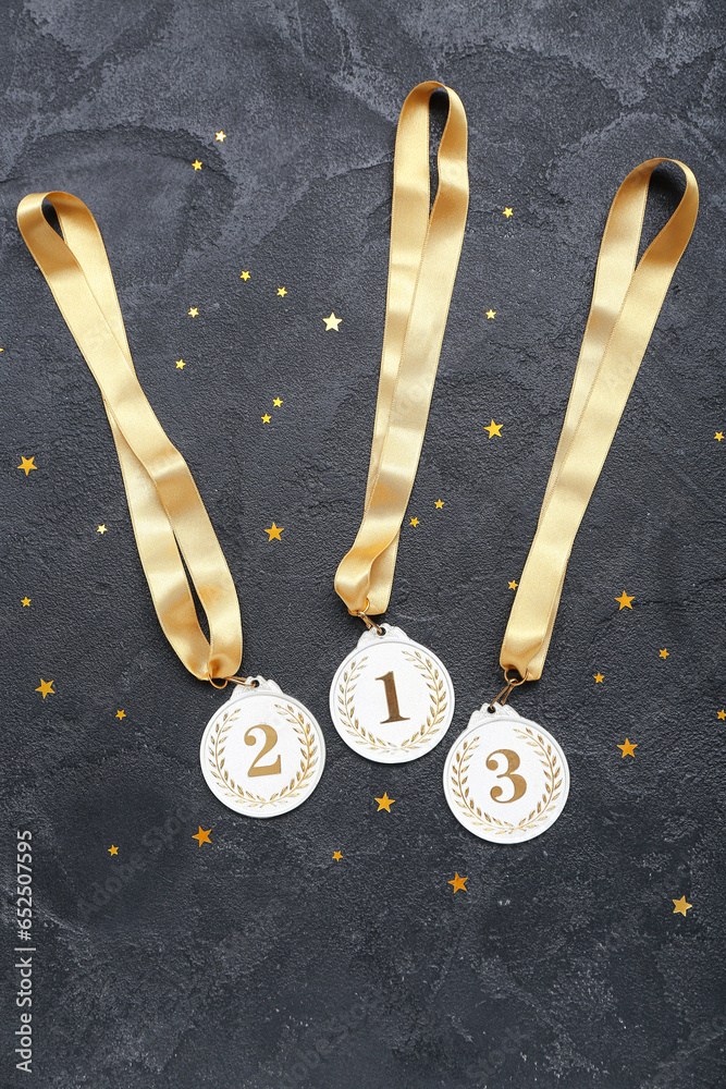 Prize medals with stars on dark background