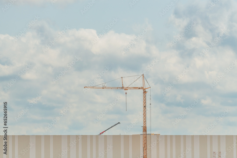 Construction crane on building site, industry and architecture concept