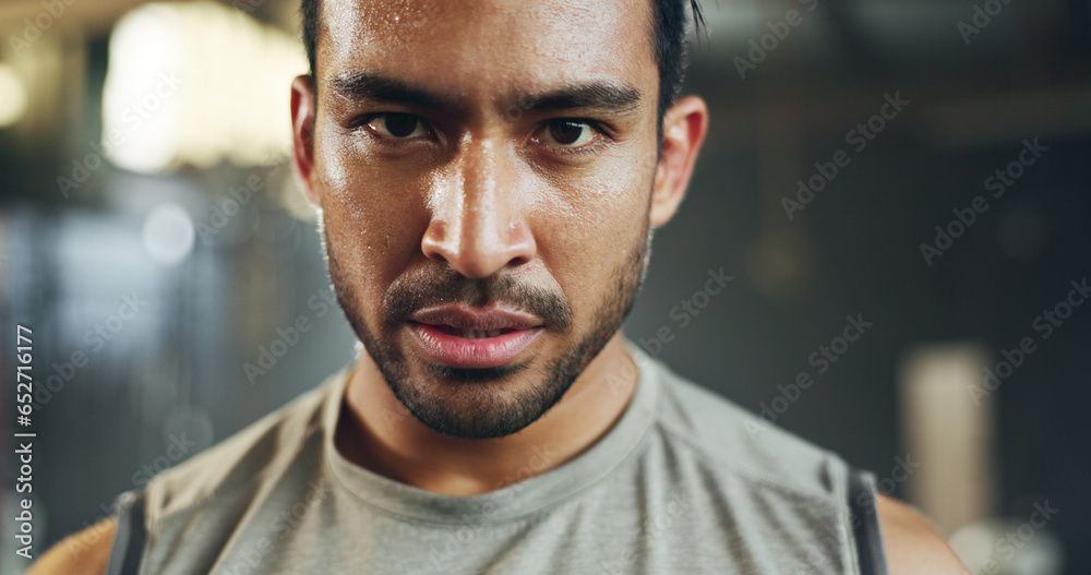 Man, sweating face and breathing in gym for fitness challenge, exercise endurance or break. Serious portrait, strong asian bodybuilder and tired for training, workout fatigue and breathe for recovery