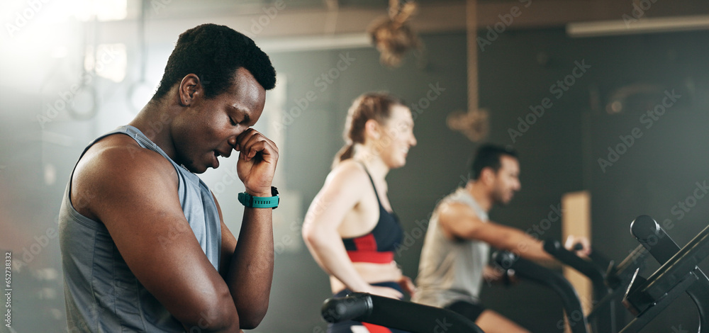 People, diversity and cycling on bicycle at gym in workout, exercise or intense cardio fitness together and motivation. Diverse group burning sweat on machine in healthy body, wellness or lose weight