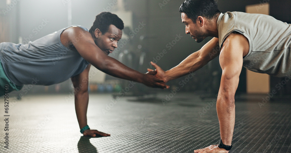 Men, pushup and together for fitness on floor with high five, synergy and motivation in gym for body health. Personal trainer, support and connection for exercise, workout and training with teamwork