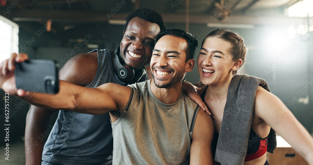 Friends, phone and reading with laughing, gym or pointing with meme, funny joke or smile with web blog. Men, woman and fitness team with smartphone, comic video or memory for training in workout room