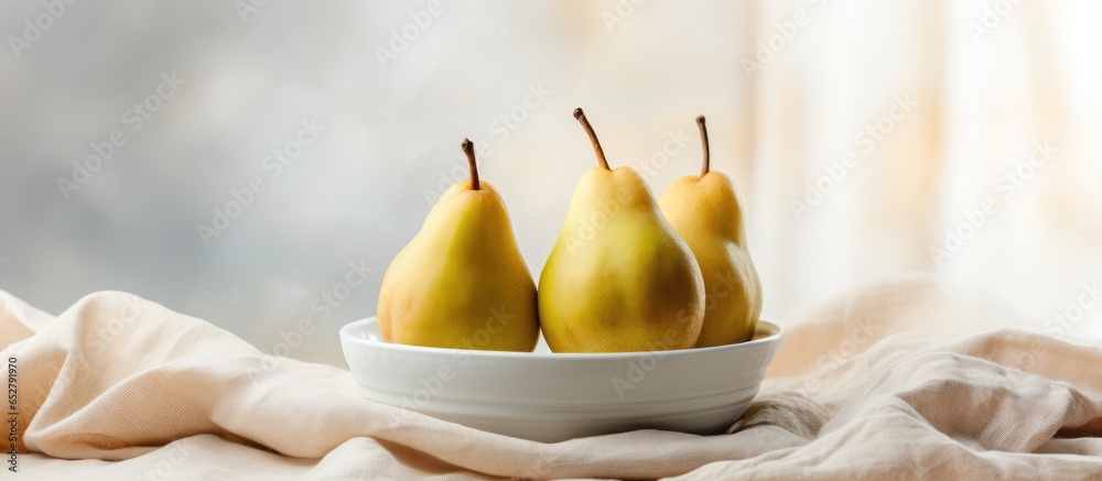 Minimalistic indoor scene with three pears on a ceramic plate white table and net curtain Light wall with copy space in the backdrop