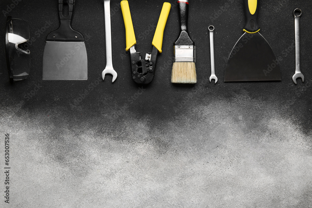 Set of construction tools on grey background