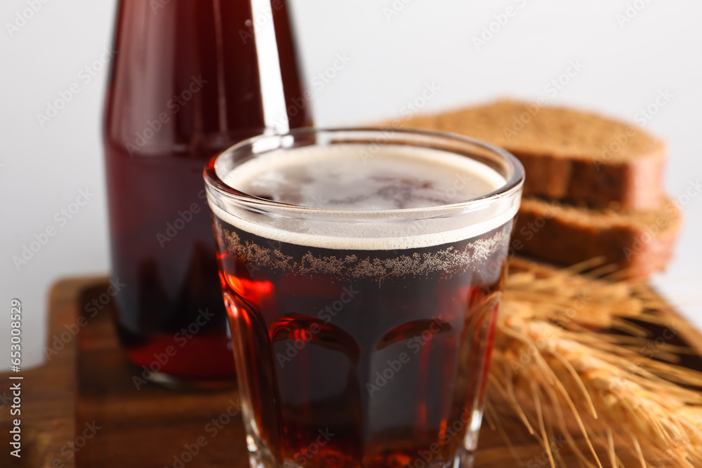 Glass of tasty kvass on grey background