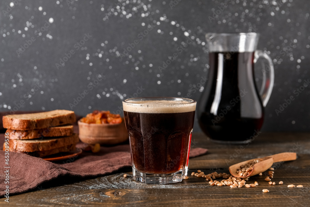 Glass of tasty kvass on table