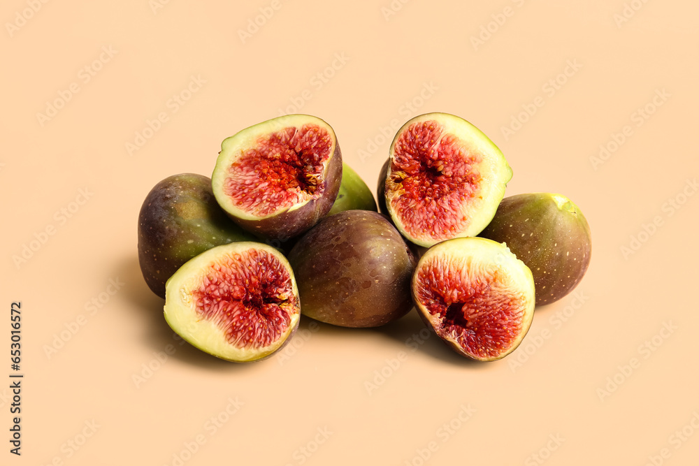 Fresh ripe figs on orange background