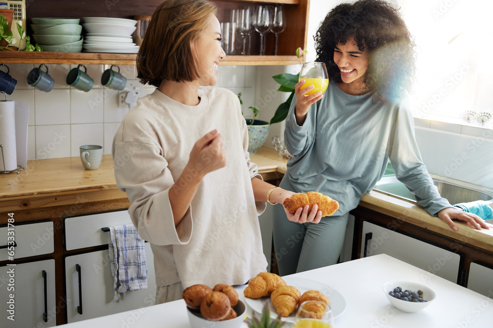 Couple, happiness and women with juice and cooking in kitchen for breakfast, nutrition and vitamin c in morning. Food, people and smile with drink and pajamas or natural face for wellness or fruit