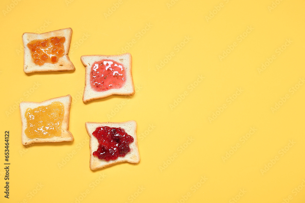 Delicious toasts with different jams on color background