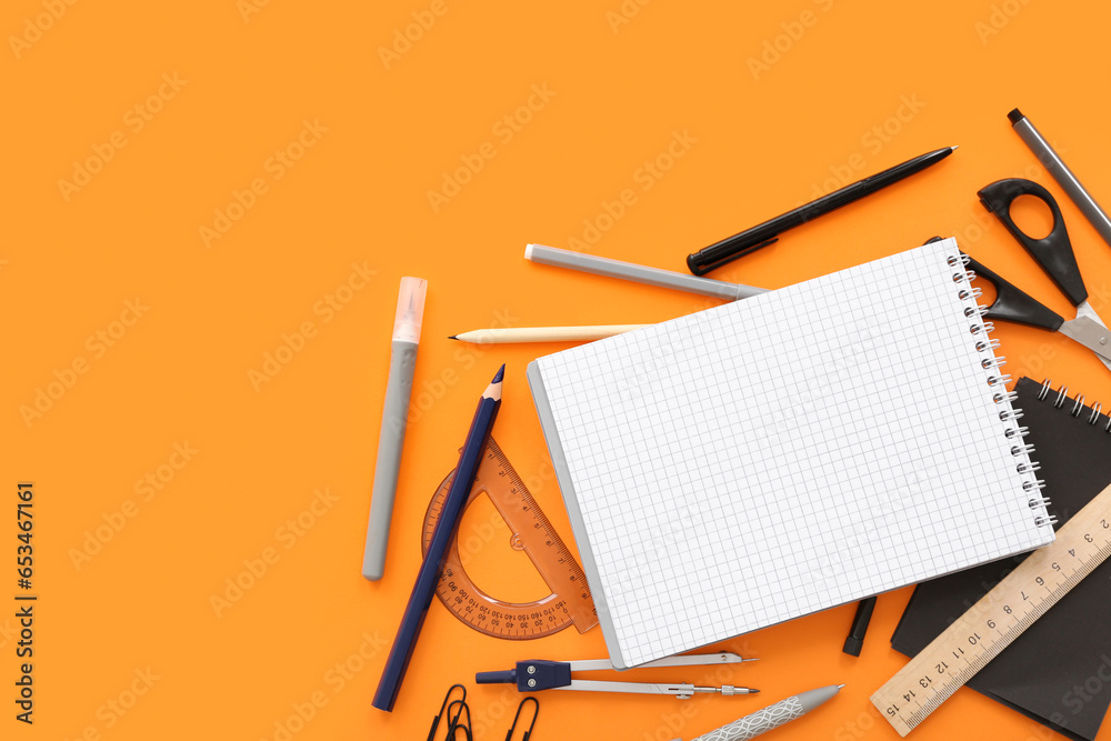 Composition with different stationery and blank notebook on color background