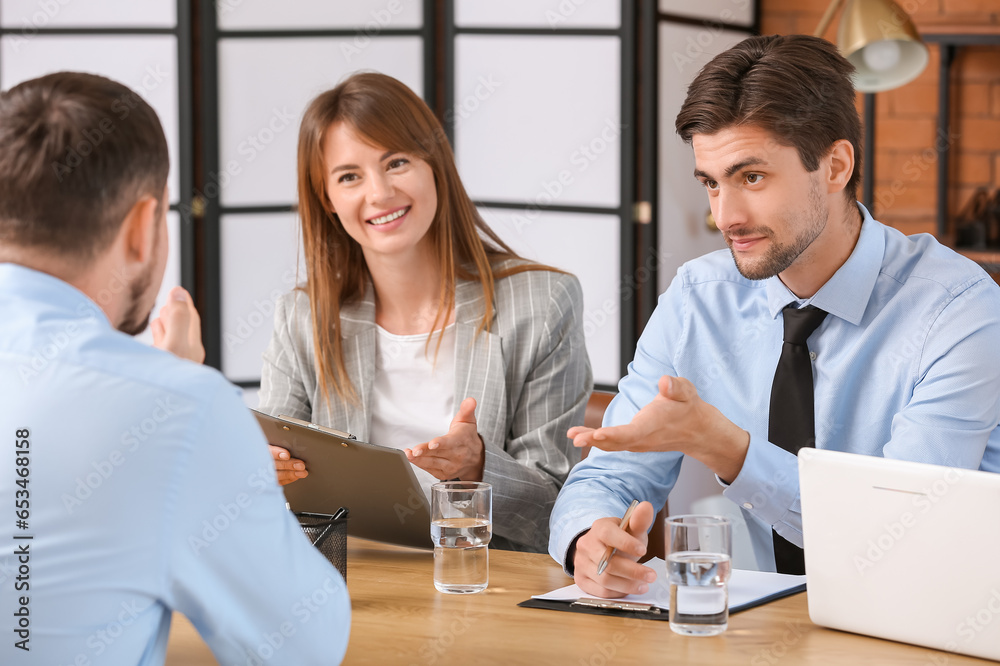 Human resources commission interviewing male applicant in office