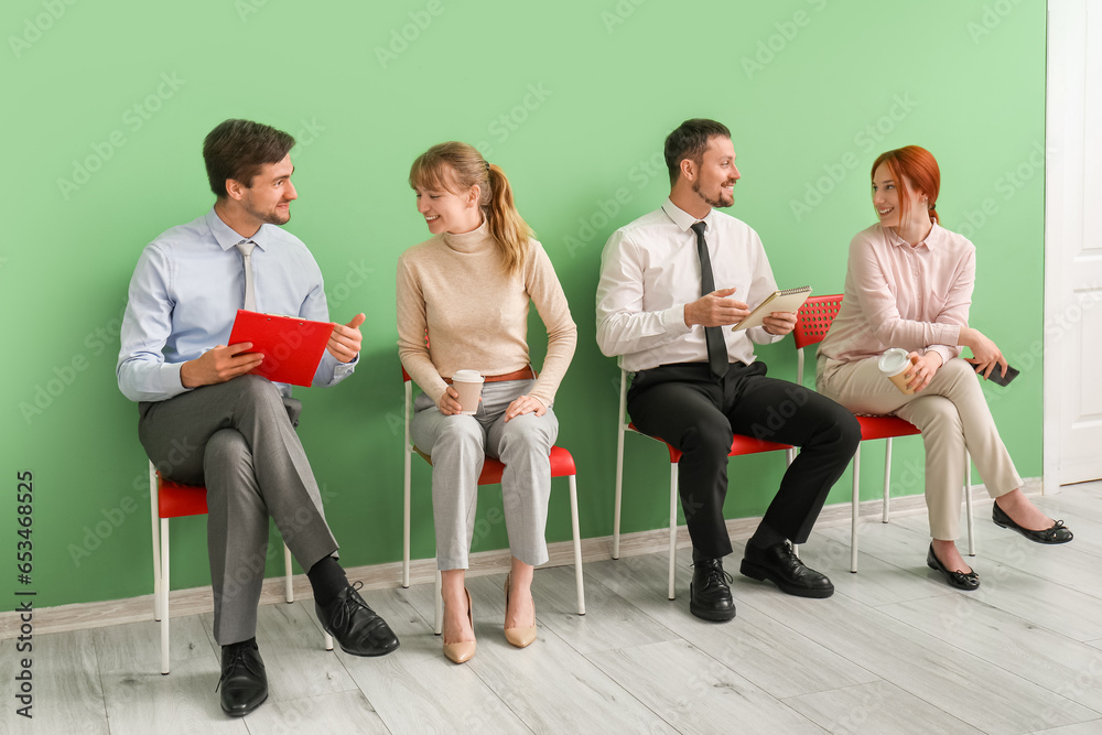 Young applicants waiting for job interview in room