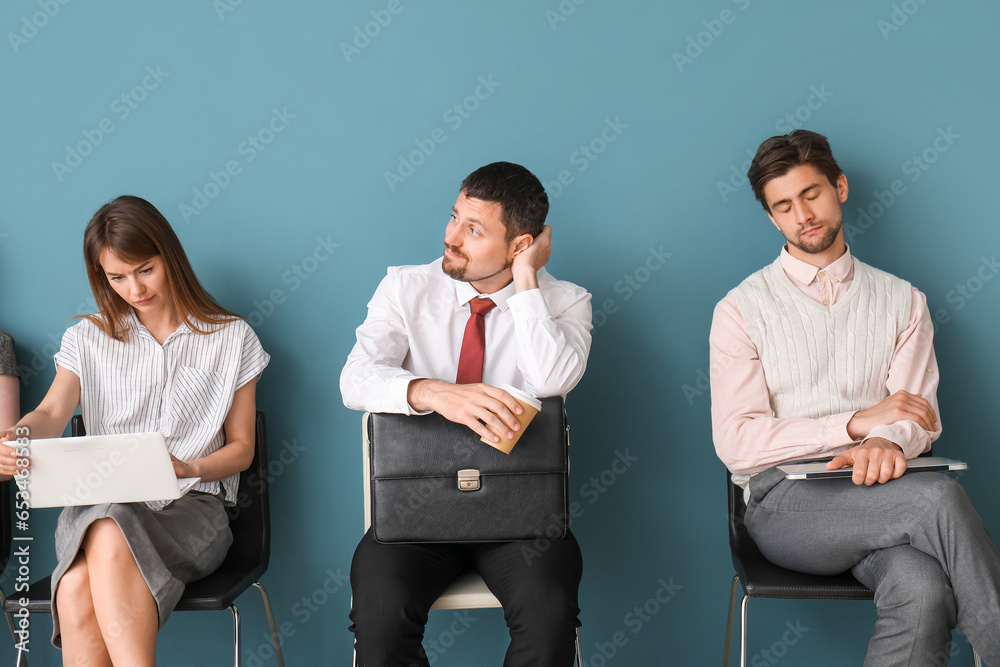 Young applicants waiting for job interview in room