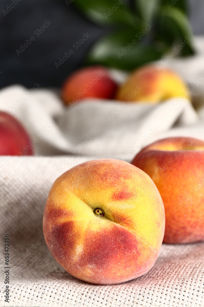 Sweet peaches on dark background, closeup