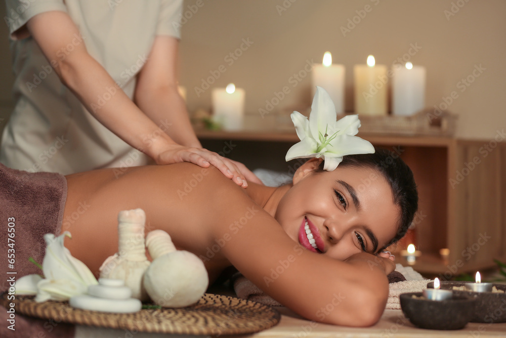 Beautiful woman receiving spa massage in salon